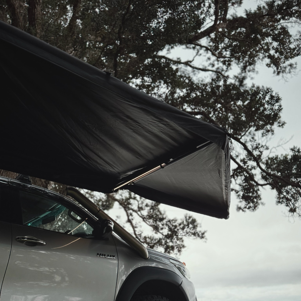 Stoke Mako 180 awning extended out from the side of the vehicle