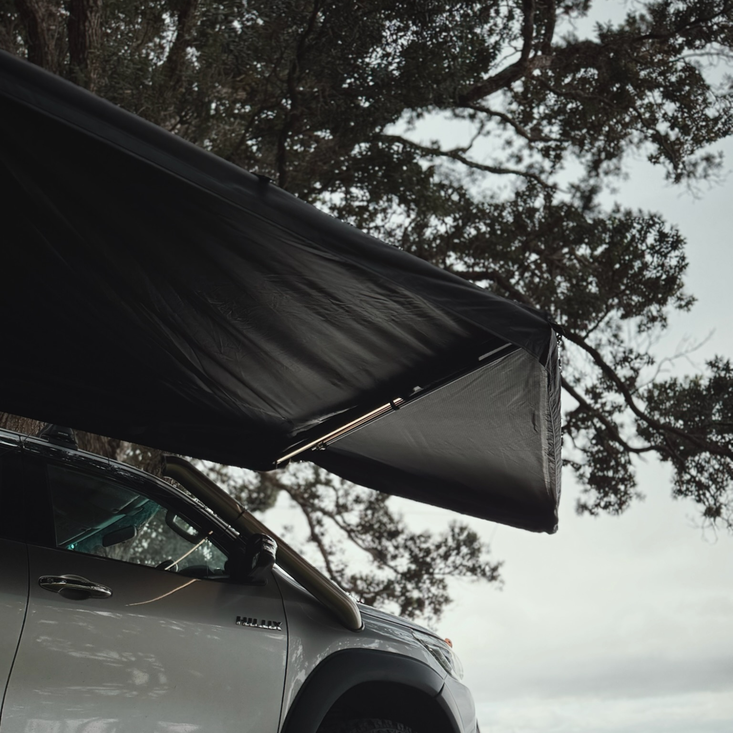 Stoke Mako 180 awning extended out from the side of the vehicle