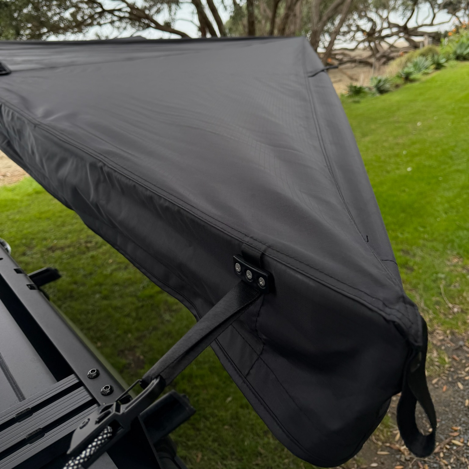 Stoke Mako 180 awning canopy corner deployed over grass