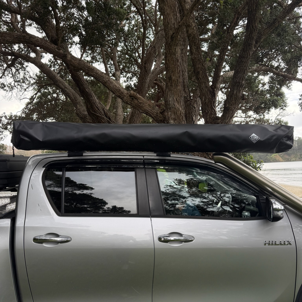 Stoke Mako 180 awning mounted closed and low-profile along the side of a 4WD
