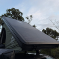 STEALTH SOLAR 43 kg hard-shell rooftop tent with integrated 180W solar panel — Stoke Supply Co.